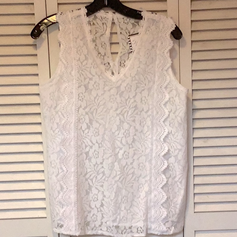 Woman’s size medium white lace V-neck blouse